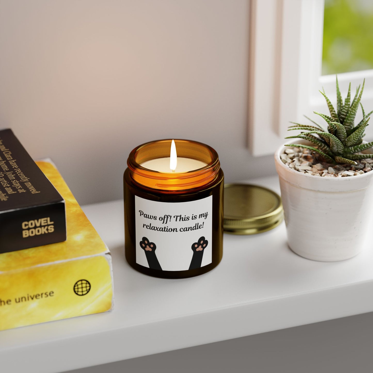 candle with cat paw image and paws off text