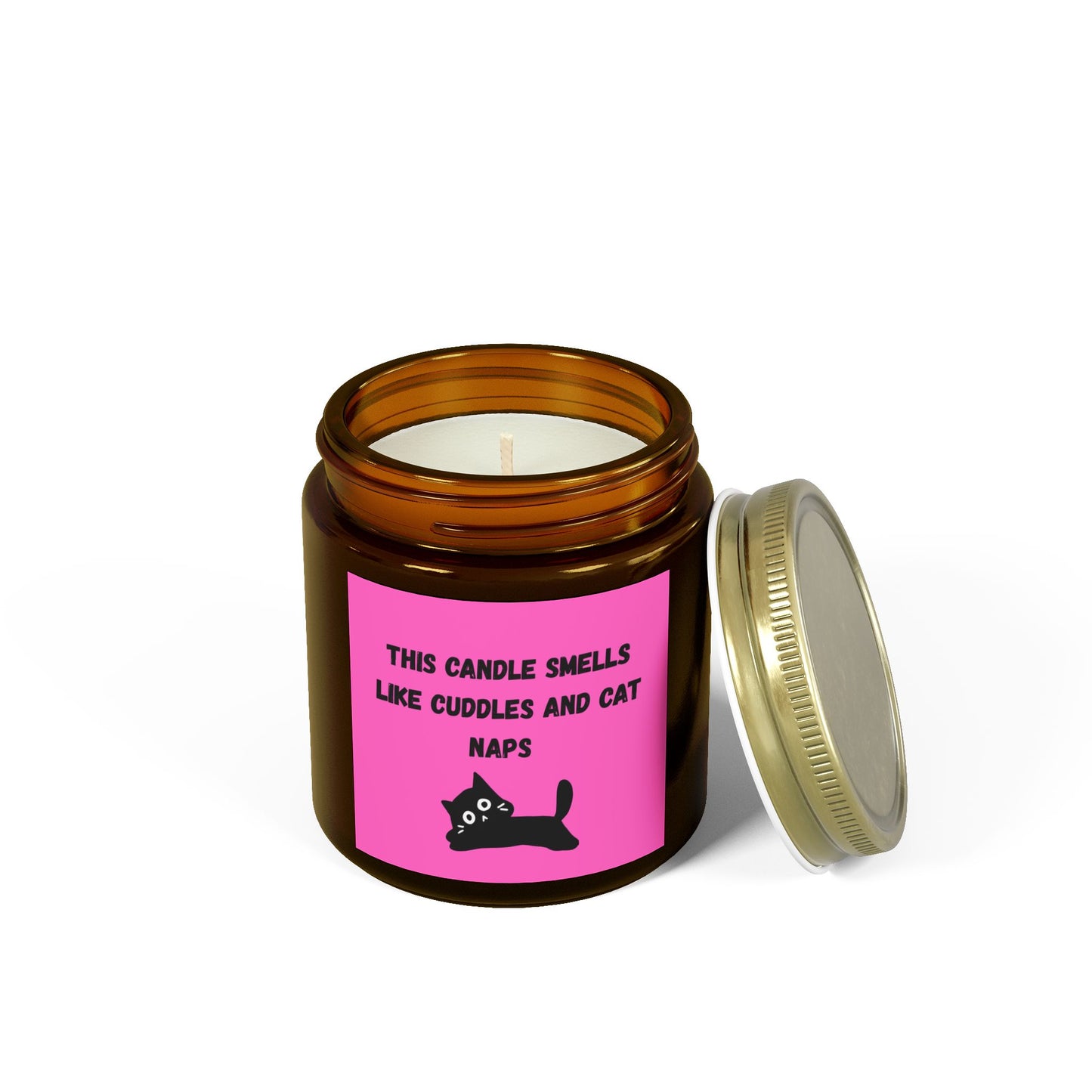 pink labelled candle with cuddles and cat nap text