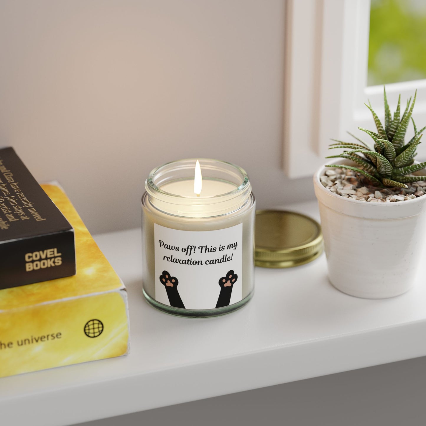 candle with cat paw image and paws off text