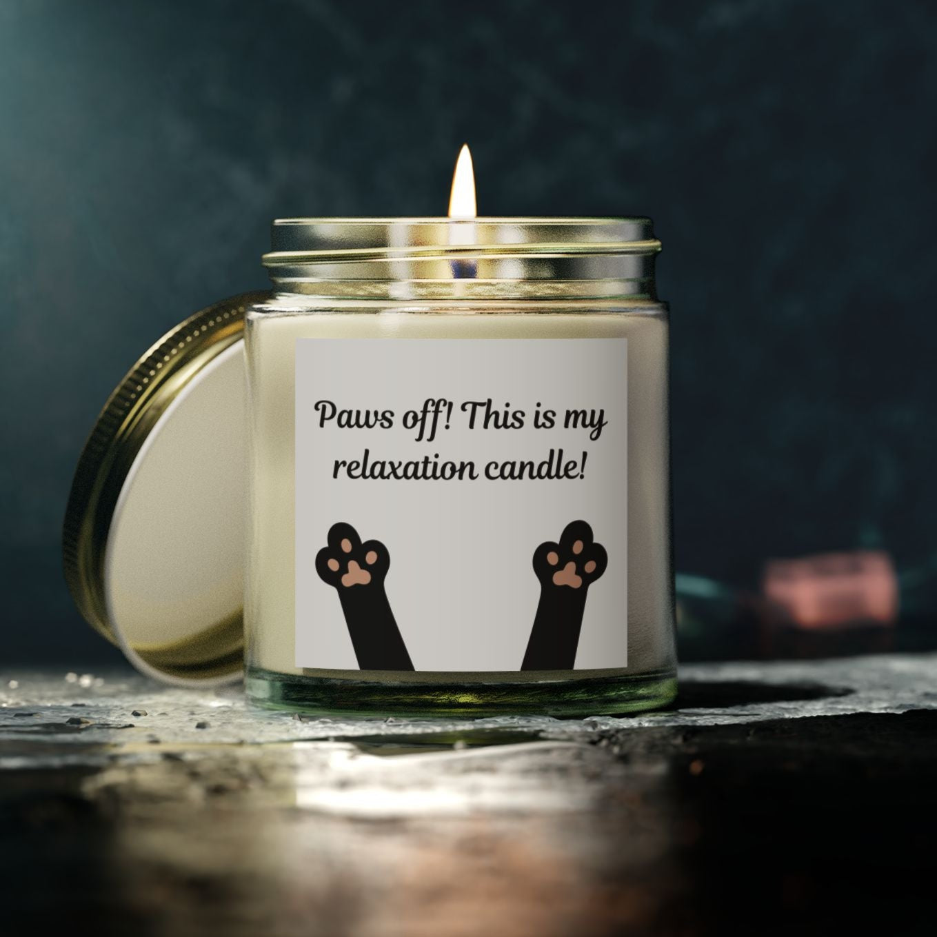candle with cat paw image and paws off text