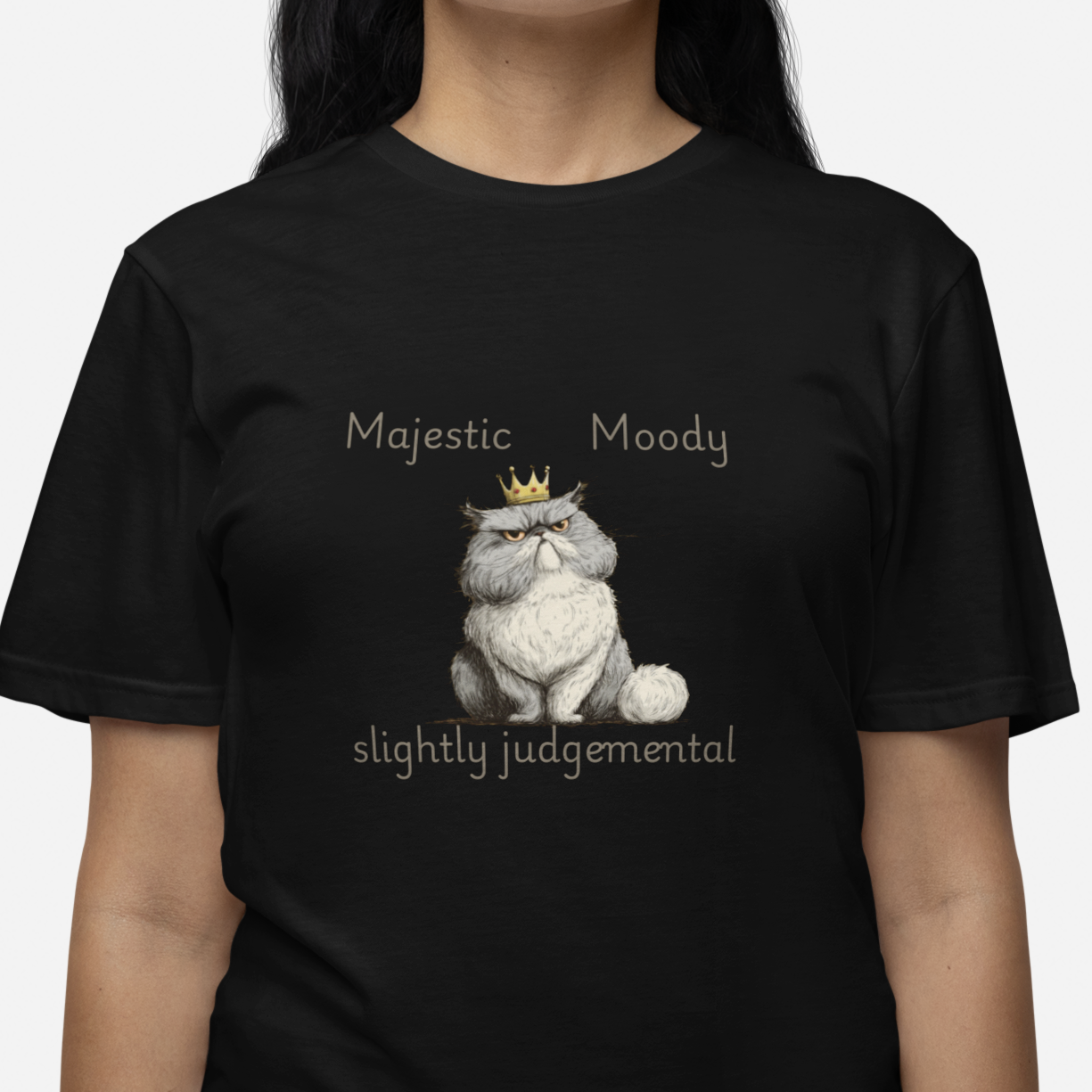 Black t-shirt with a graphic of a cat and text worn by a person on a white background