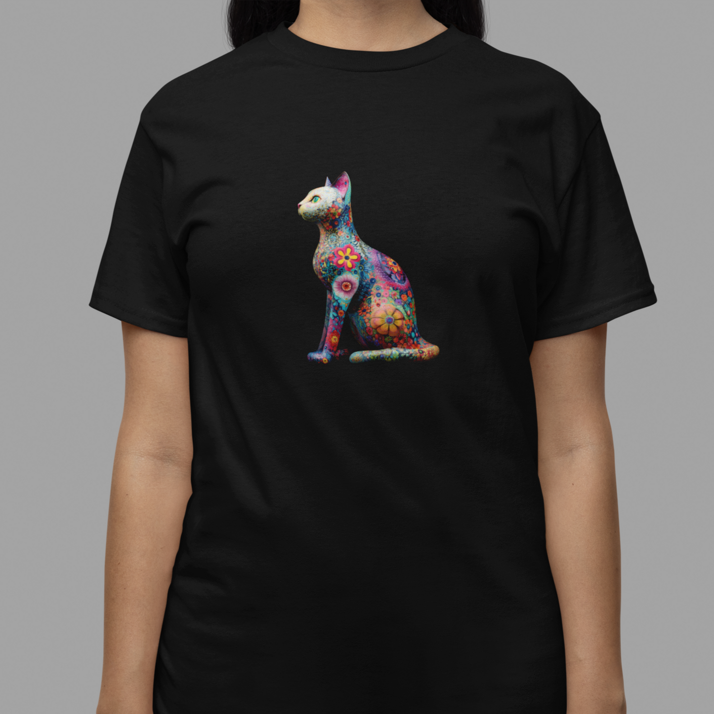 Black t-shirt with a colorful cat graphic worn by a person on a gray background