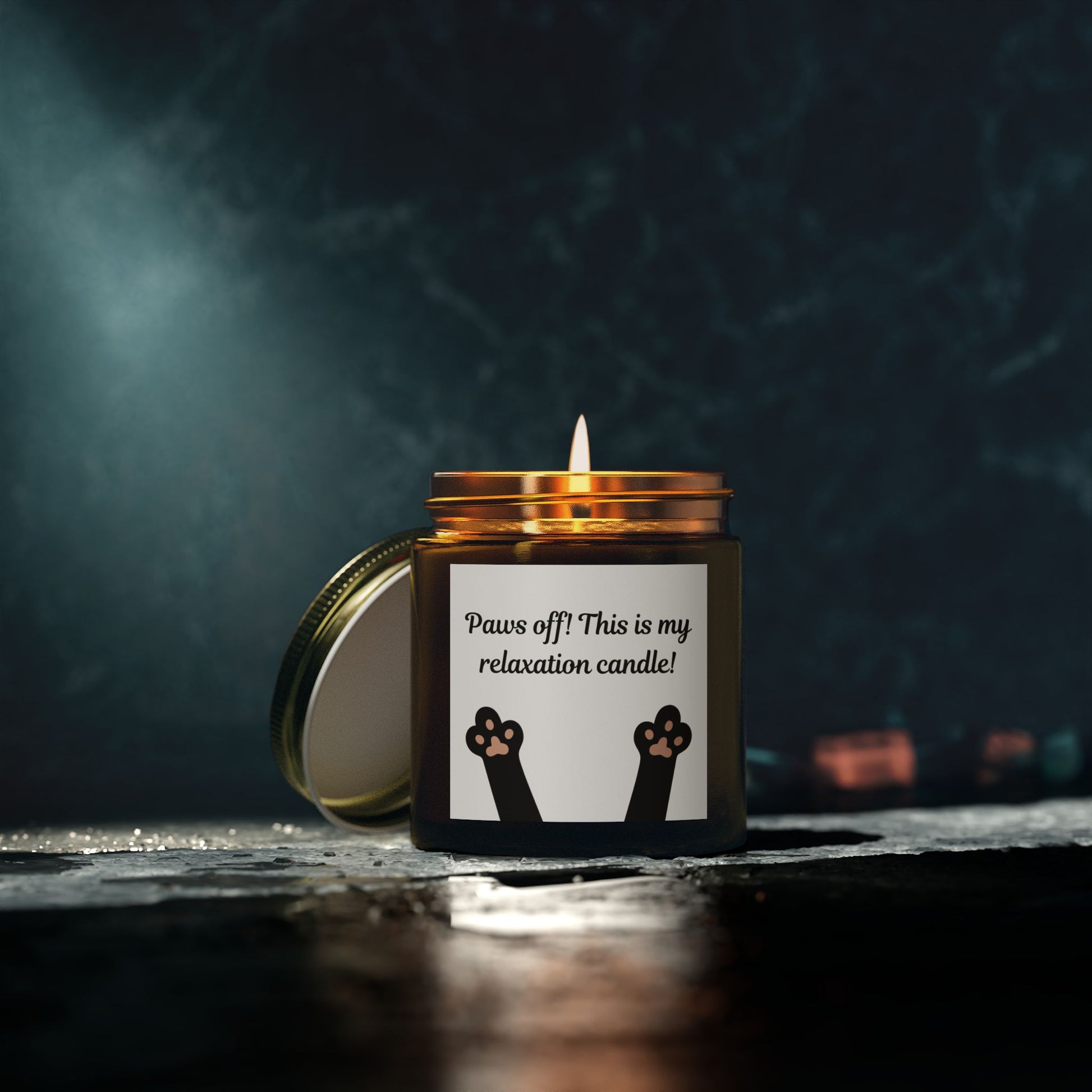 candle with cat paw image and paws off text