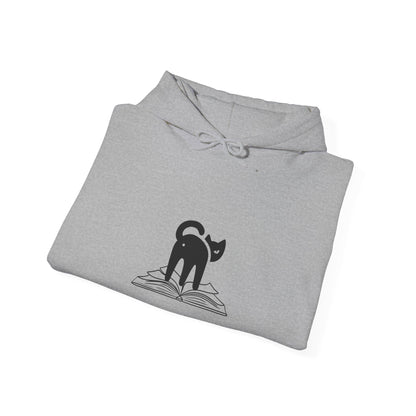 image of cat looking back on top of a book hoodie