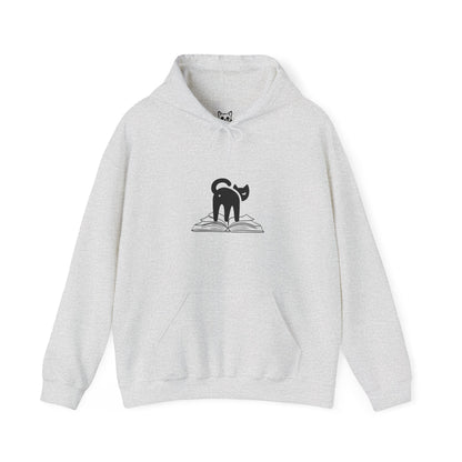image of cat looking back on top of a book hoodie