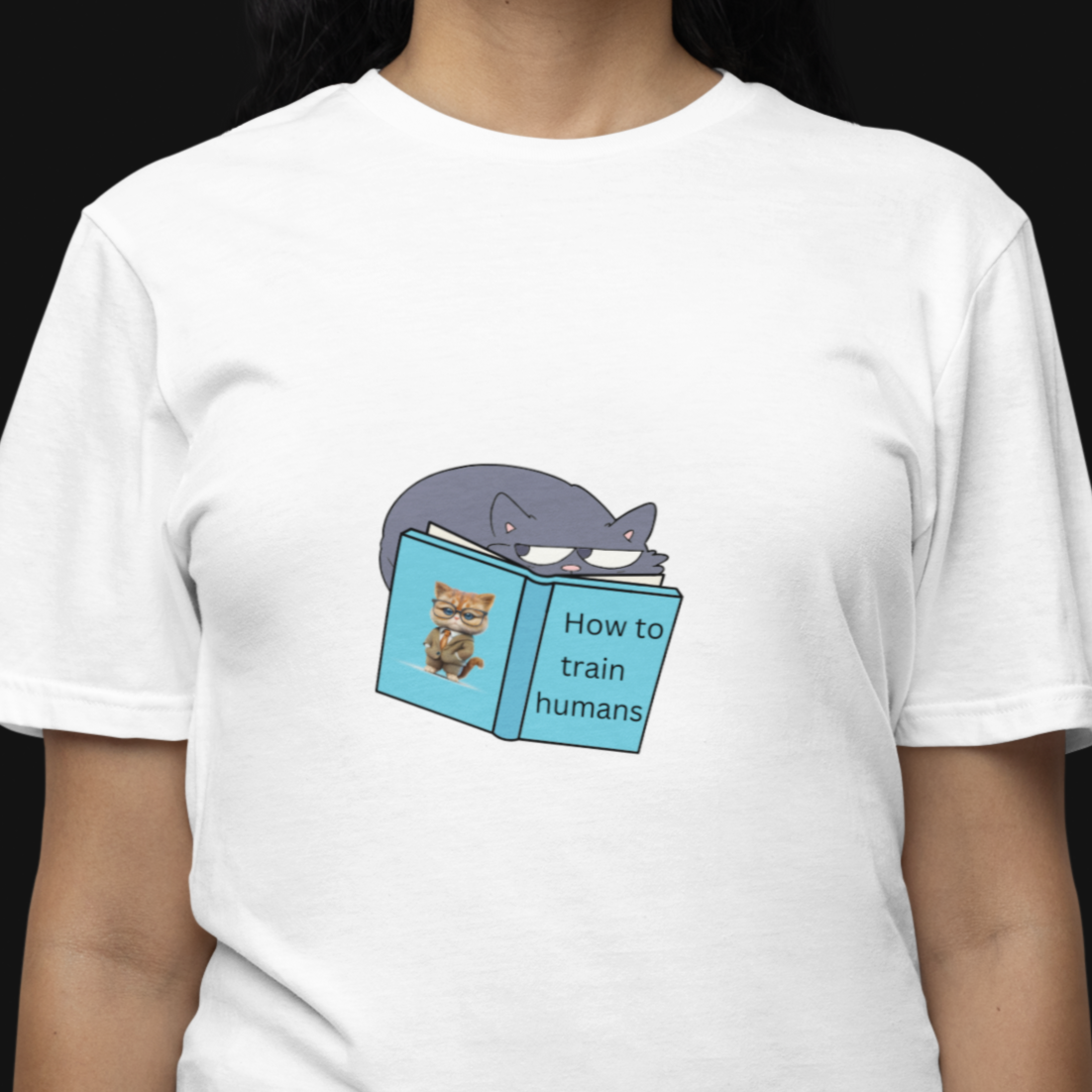 Person wearing a white t-shirt with a graphic design on a black background