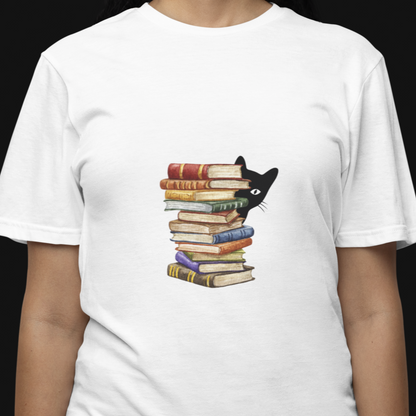 Person wearing a white t-shirt with a graphic of a cat peeking out from books.