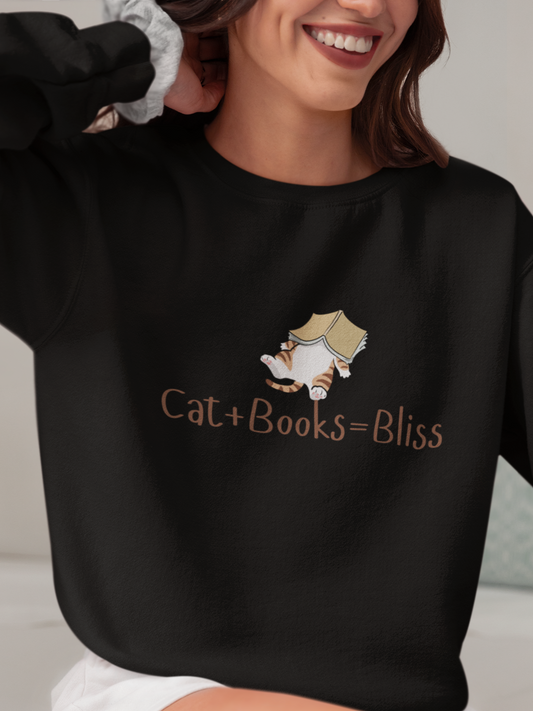 Person wearing a black sweatshirt with 'Cat + Books = Bliss' text and a cat graphic.