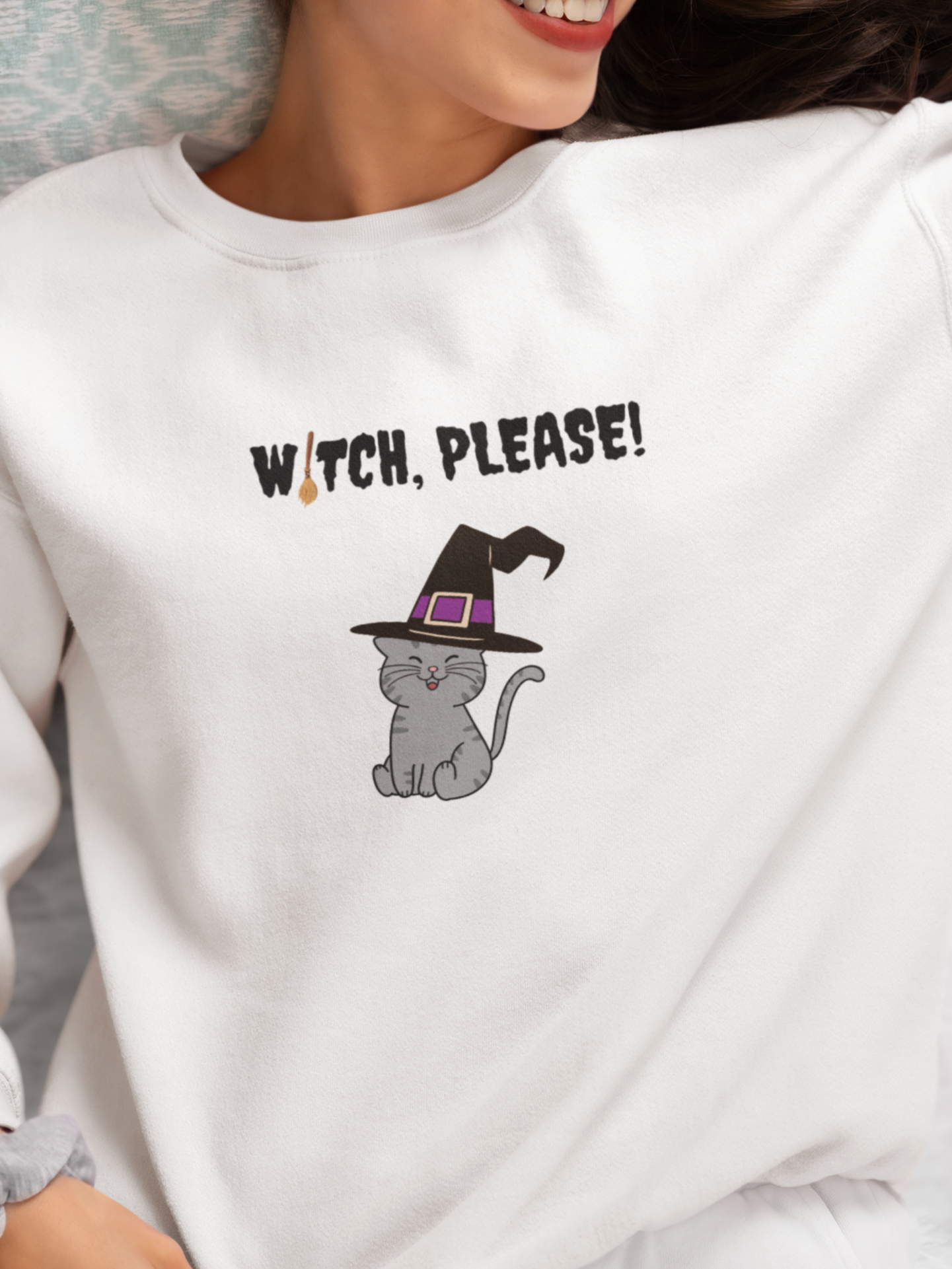 Person wearing a white sweatshirt with a cat in a witch hat and 'Witch, Please!' text.