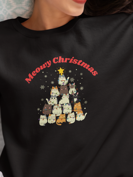 Person wearing a black sweatshirt with a Christmas-themed design and text.