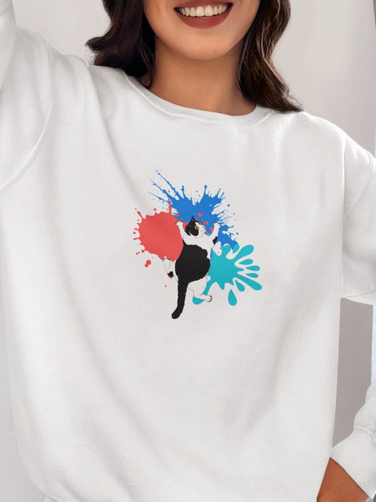 Person wearing a white sweatshirt with a colorful graphic design, standing against a neutral background.