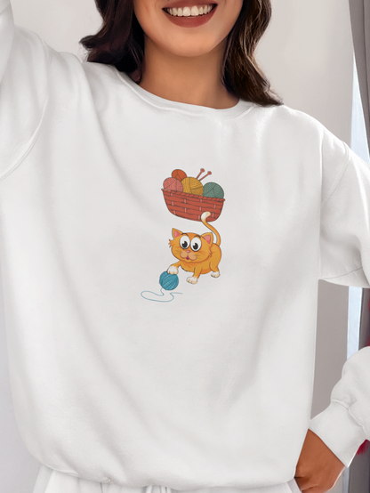 Person wearing a white sweatshirt with a cartoon character design, smiling and posing indoors.