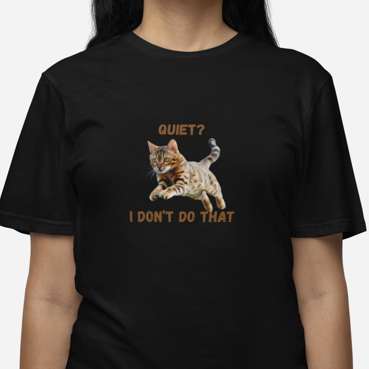 Black t-shirt with a cat graphic and text worn by a person on a white background