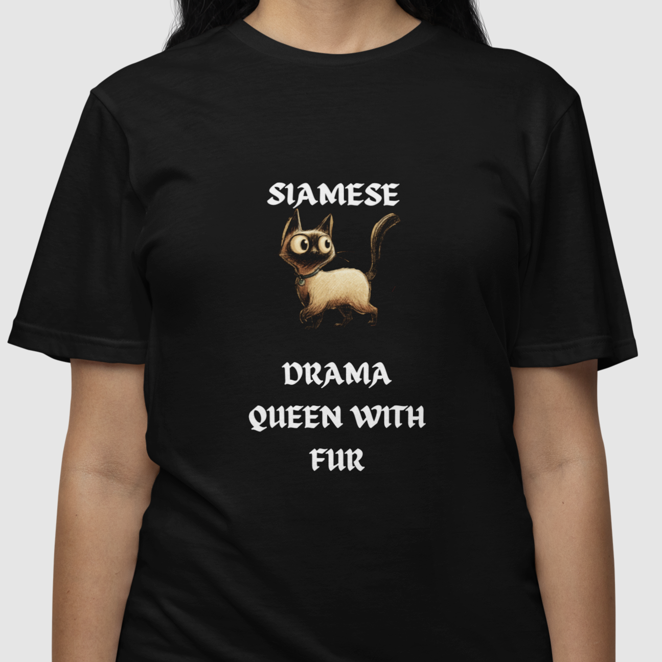 Black t-shirt with a cat graphic and text on a white background
