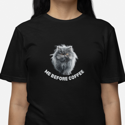 Black t-shirt with a cat graphic and text 'Me Before Coffee' worn by a person on a white background
