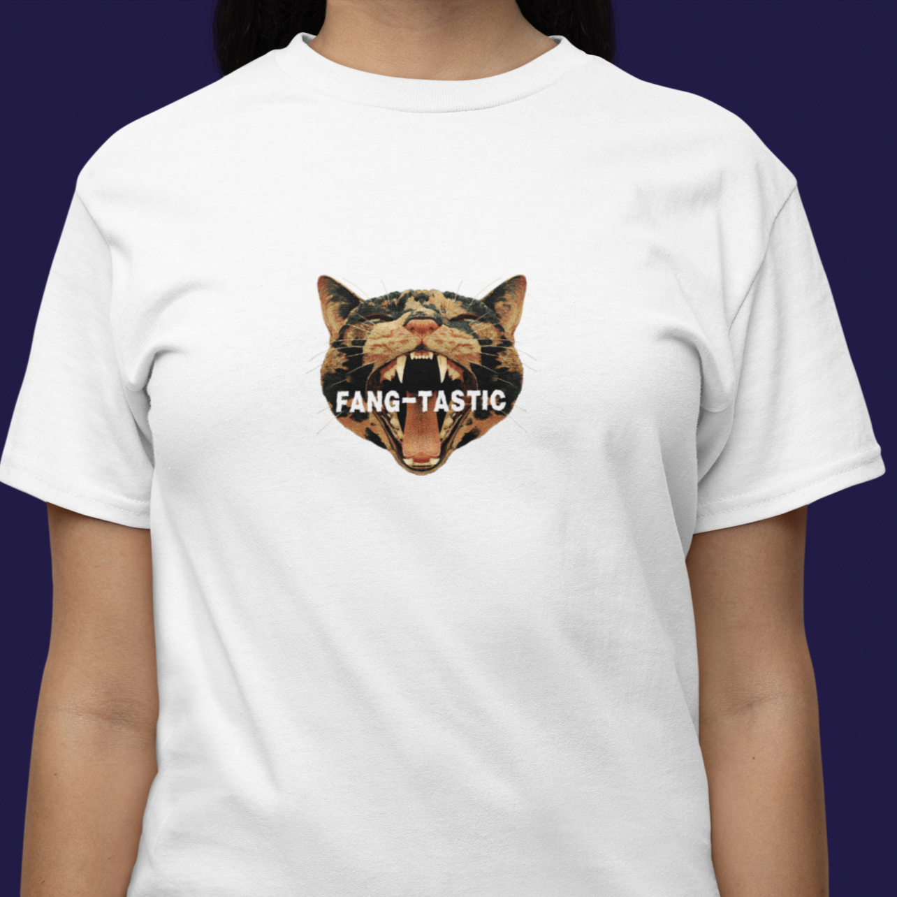 Person wearing a white t-shirt with a graphic of a bear and the word 'FANG-TASTIC' on a dark background