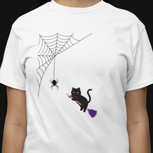 White t-shirt with a black cat, spider, and web design on a person against a black background