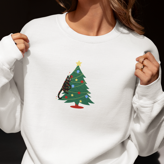 Person wearing a white sweatshirt with a Christmas tree design.