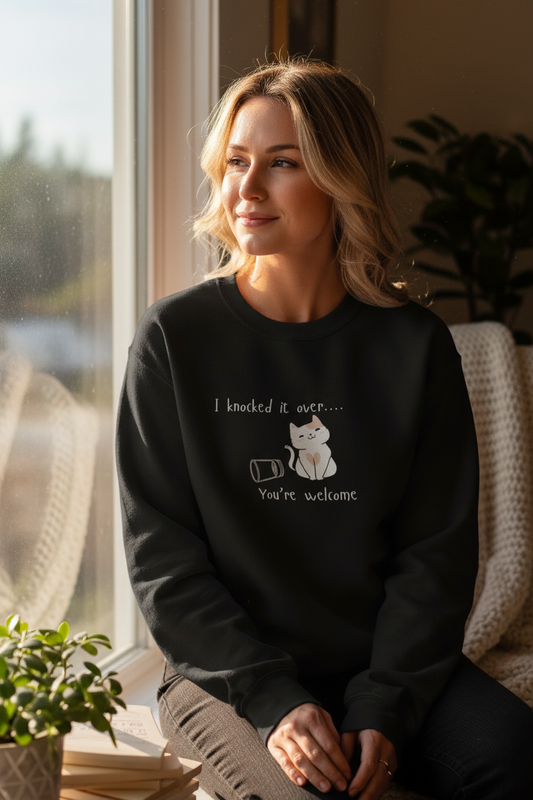 Person wearing No Regrets sweater by window at home